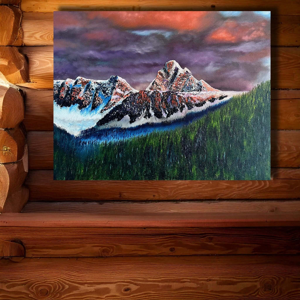 mountain painting of Fissile Peak with dramatic sunset colors and evergreen forest backdrop