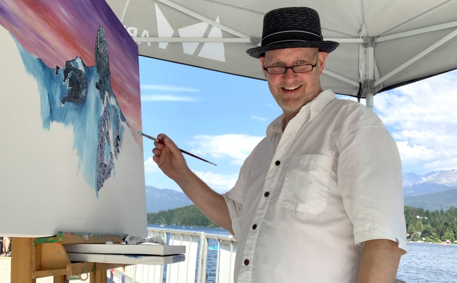 Canadian artist Graham Watts painting outdoors in Whistler, British Columbia